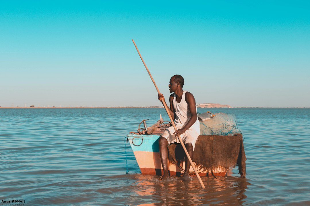 young fisherman boat