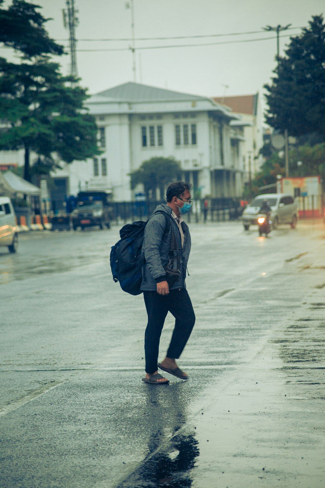 Candid portrait of a Chilean man on a city street looking away from the camera